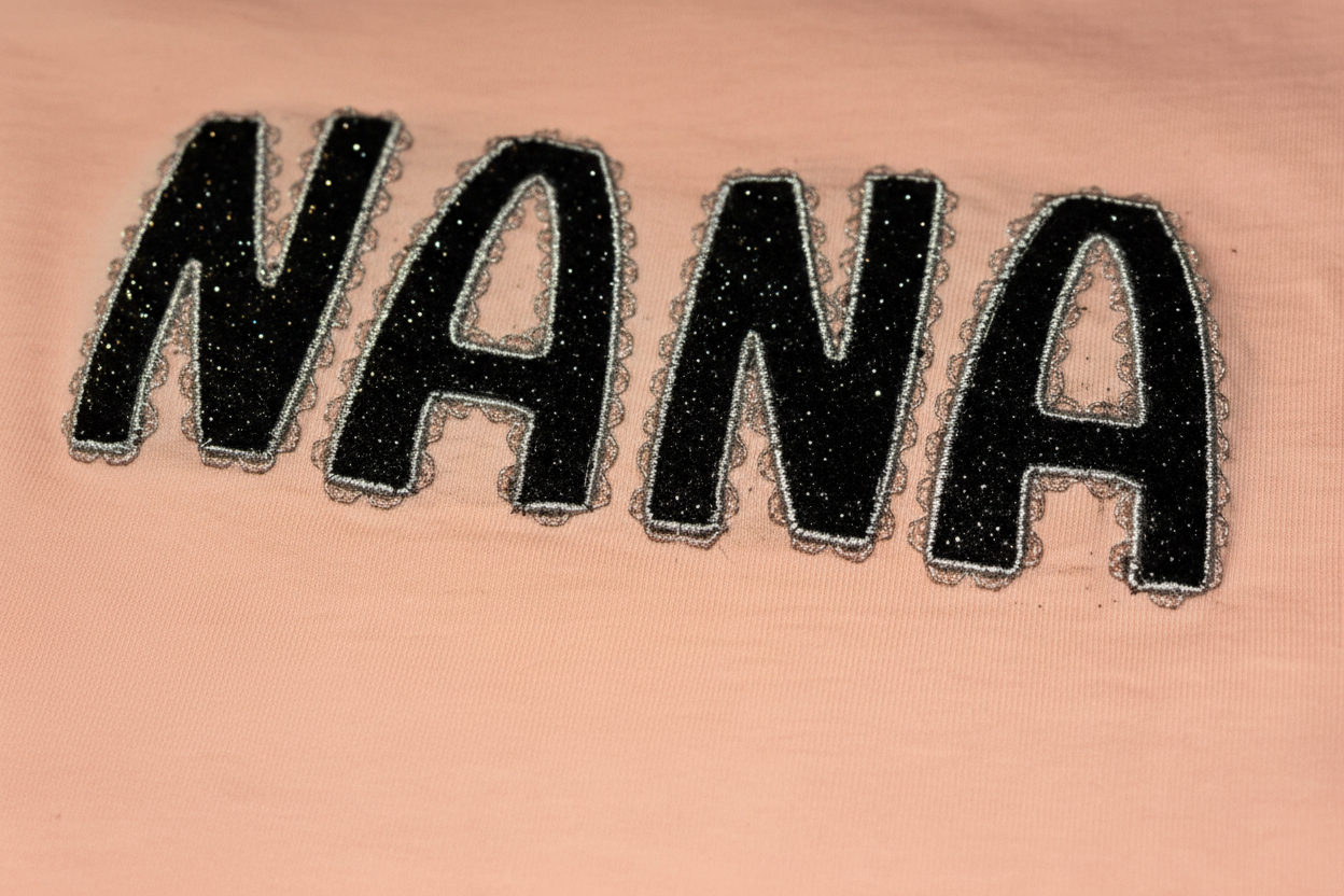NANA embroidery close-up detail